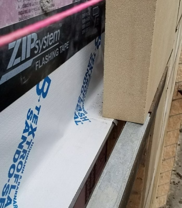 Steel lintel replacement and brick repair on a Glencoe IL home.